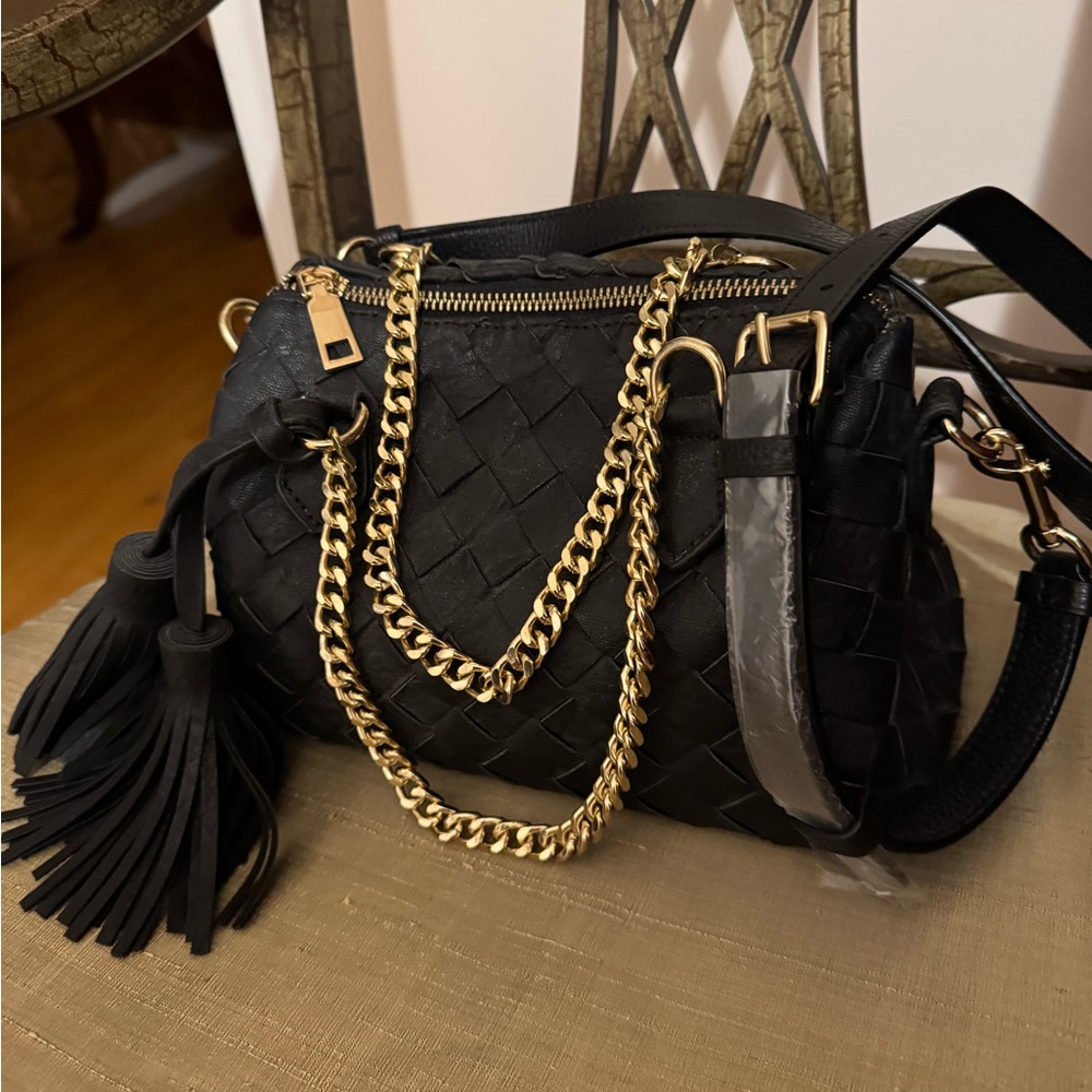 Black woven leather bag. Beautiful gold chain handles Cross body strap